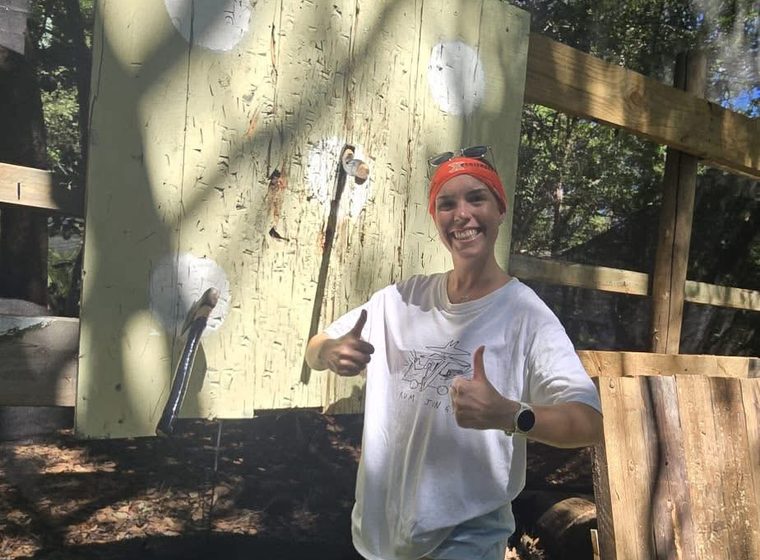 A thrower with her axe after a session