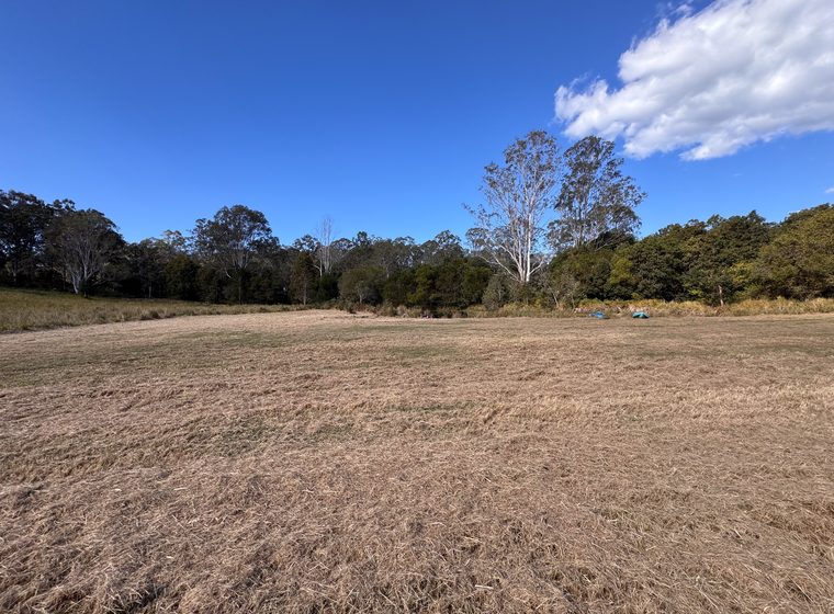 The open ground between the camp area and the dam